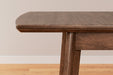 Lyncott Dining Extension Table - World Furniture Gallery (Newark, CA)