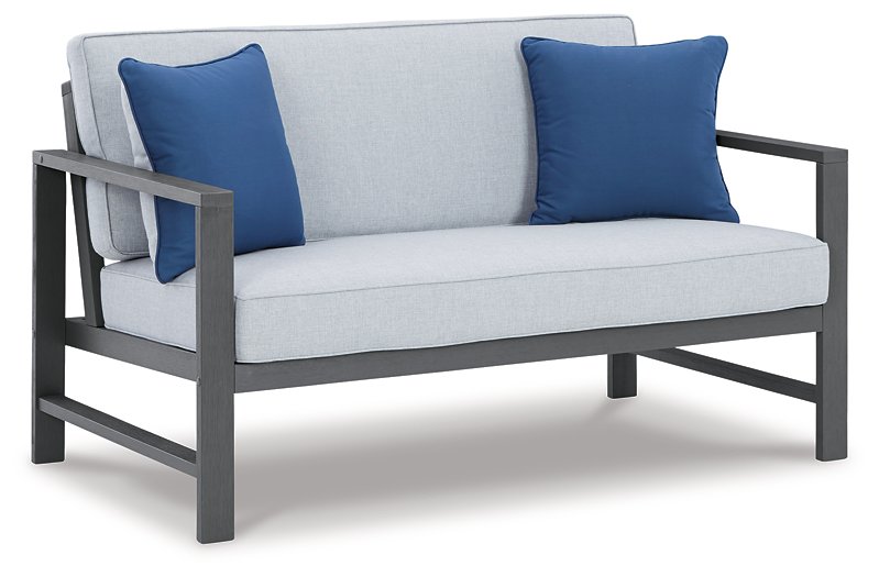 Fynnegan Outdoor Loveseat with Table (Set of 2) - World Furniture Gallery (Newark, CA)