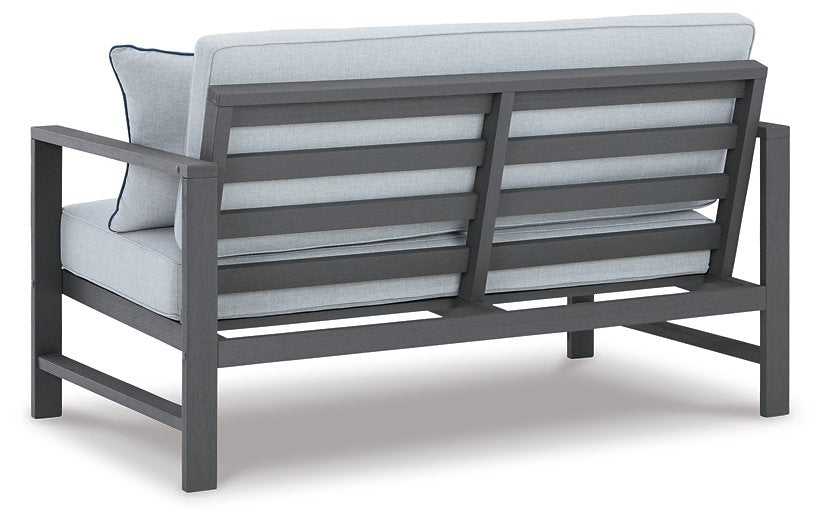 Fynnegan Outdoor Loveseat with Table (Set of 2) - World Furniture Gallery (Newark, CA)