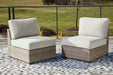 Calworth Outdoor Armless Chair with Cushion (Set of 2) - World Furniture Gallery (Newark, CA)