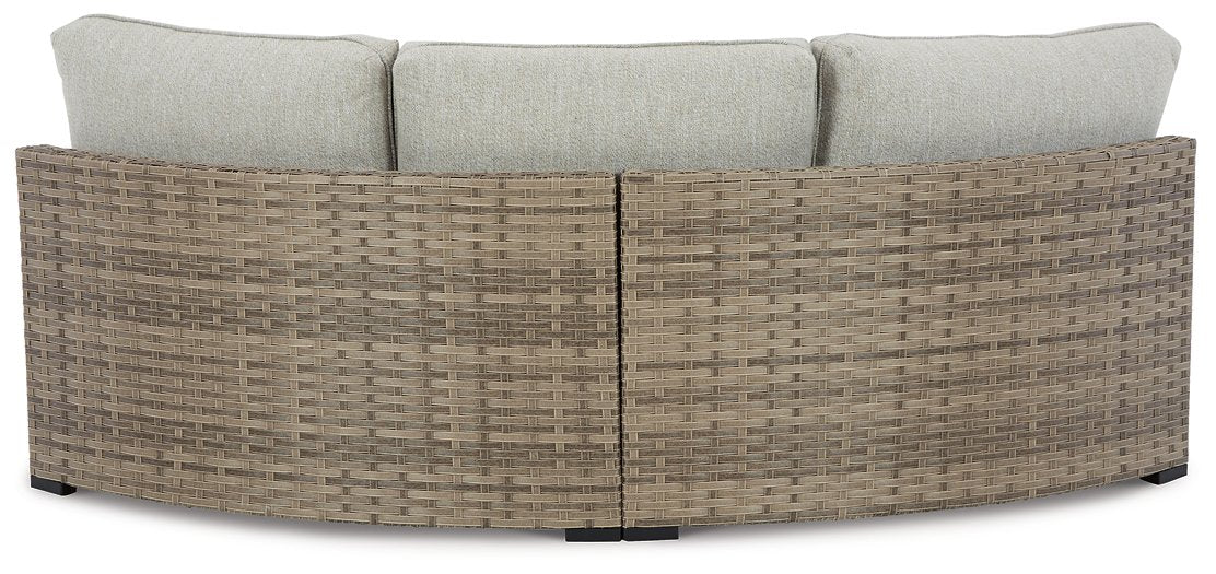 Calworth Outdoor Curved Loveseat with Cushion - World Furniture Gallery (Newark, CA)